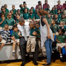 During his 2012 campaign, President Obama surprised students in Delray Beach, Fla., with an unscheduled stop to take a photo with the kids. But perhaps the biggest surprise of this photo op was the kissing pair in the back row photobombing the president. (<a href="https://twitter.com/BarackObama/status/260926825843290112" rel="nofollow noopener" target="_blank" data-ylk="slk:@BarackObama;elm:context_link;itc:0;sec:content-canvas" class="link ">@BarackObama</a>/Twitter)