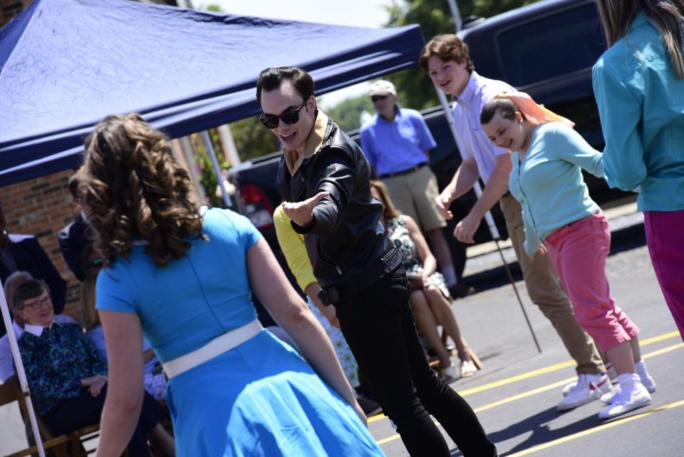 Members from the Riverbank Theatre group perform a single from the musical "Bye Bye Birdie," during the groundbreaking ceremony for the new Boardwalk Theatre in downtown St. Clair on Tuesday, June 28, 2022.