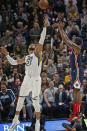 Washington Wizards guard Bradley Beal (3) shoots as Utah Jazz center Rudy Gobert (27) defends in the first half during an NBA basketball game Friday, Feb. 28, 2020, in Salt Lake City. (AP Photo/Rick Bowmer)