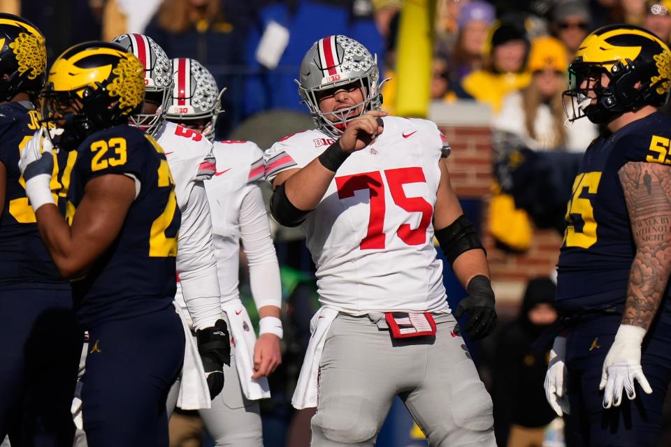 Nov 25, 2023; Ann Arbor, Michigan, USA; Ohio State Buckeyes offensive lineman Carson Hinzman (75) calls out a Michigan Wolverines defense during the NCAA football game at Michigan Stadium. Ohio State lost 30-24.