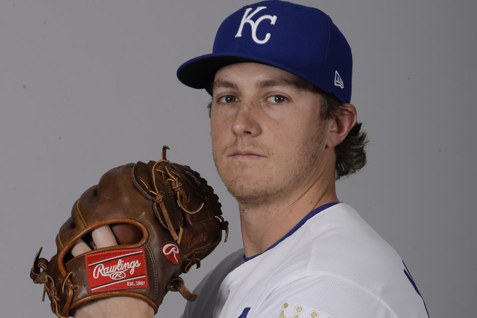 FILE - Seth Maness of the Kansas City Royals baseball team poses Feb. 20, 2017, in Surprise, Ariz. Tommy John surgery, like baseball itself, is evolving to increase success and sometimes speed return. Maness became the first pitcher back in the majors following the pioneer operation after just just eight months, 27 days, in 2017. "I was all in, and I’m glad I did it," Maness said. (AP Photo/Charlie Riedel, File)