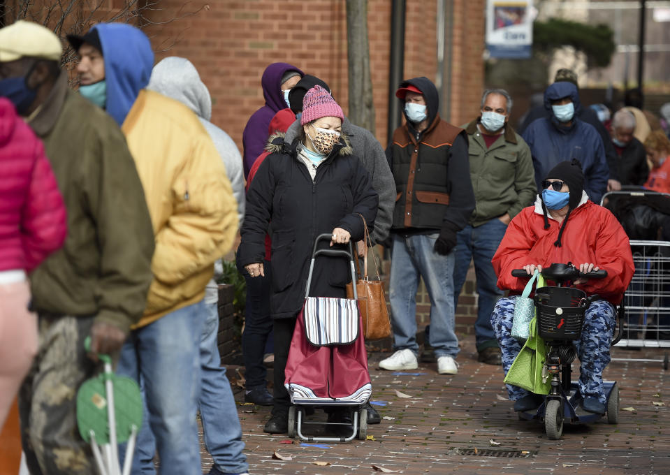 Reading, PA - November 23: People wait in line to get turkeys. During the distribution for the Annual Alvernia University Turkey Drive Monday morning November 23, 2020 at their new downtown College Towne Location on Penn Street in Reading. (Photo by Ben Hasty/MediaNews Group/Reading Eagle via Getty Images)