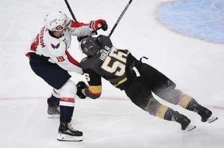 May 30, 2018; Las Vegas, NV, USA; Vegas Golden Knights left wing Erik Haula (56) collides with Washington Capitals center Nicklas Backstrom (19) in the second period in game two of the 2018 Stanley Cup Final at T-Mobile Arena. Stephen R. Sylvanie-USA TODAY Sports