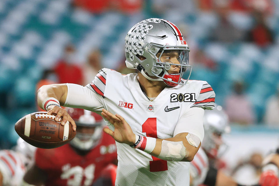 MIAMI GARDENS, FLORIDA - JANUARY 11: Justin Fields #1 of the Ohio State Buckeyes looks to pass during the fourth quarter of the College Football Playoff National Championship game against the Alabama Crimson Tide at Hard Rock Stadium on January 11, 2021 in Miami Gardens, Florida. (Photo by Mike Ehrmann/Getty Images)