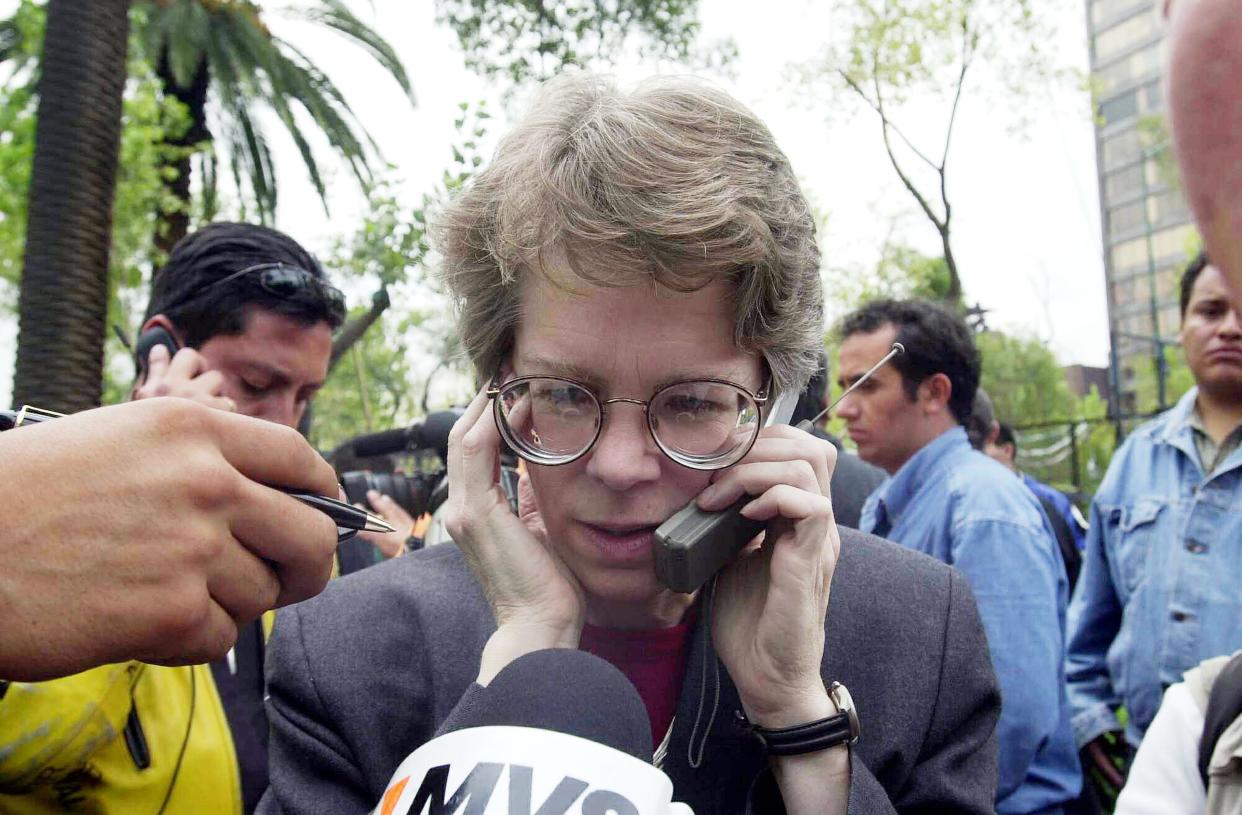 Jossie Schumake, a US embassy representative in Mexico City, speaks to the press September 11, 2001 during a evacuation of the US embassy in Mexico City after attacks on New York City and Washington DC by alleged terrorists.