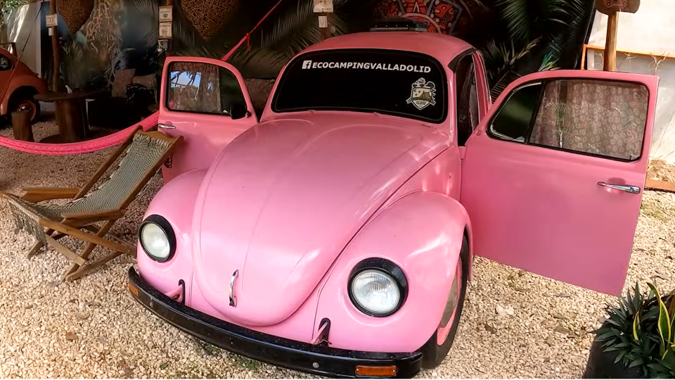 Pink car on gravel path