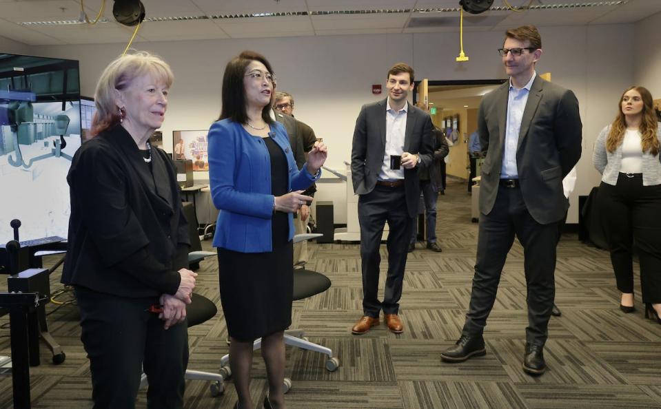 U.S. Department of Energy's Geri Richmond (left), Purdue Northwest University's Chenn Zhou (center) and U.S. Congressman Frank Mrvan (second from right) tour the Center for Innovation through Visualization and Simulation. The DOE recently awarded the center $7.1 million for its efforts in decarbonizing the steel industry.