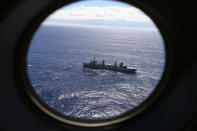 <p> FILE - In this March 31, 2014 file photo, HMAS Success scans the southern Indian Ocean, near the coast of Western Australia, as a Royal New Zealand Air Force P3 Orion flies over, while searching for missing Malaysia Airlines Flight MH370. After nearly three years, the hunt for Malaysia Airlines Flight 370 ended in futility and frustration on Tuesday, Jan. 17, 2017, as crews completed their deep-sea search of a desolate stretch of the Indian Ocean without finding a single trace of the plane. (AP Photo/Rob Griffith, File) </p>