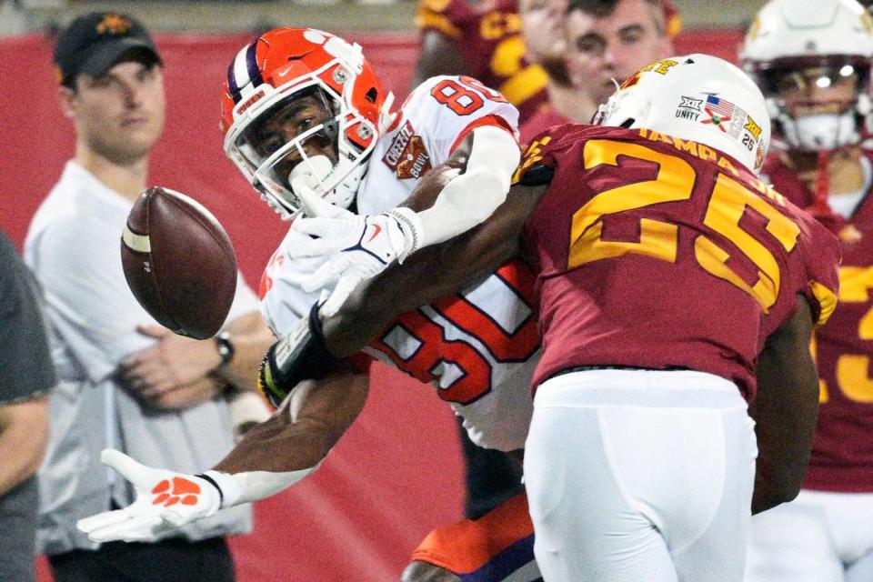 Clemson wide receiver Beaux Collins (80) can’t make the catch as Iowa State defensive back T.J. Tampa (25) breaks up the pass during the first half of the Cheez-It Bowl NCAA college football game, Wednesday, Dec. 29, 2021, in Orlando, Fla. (AP Photo/Phelan M. Ebenhack)