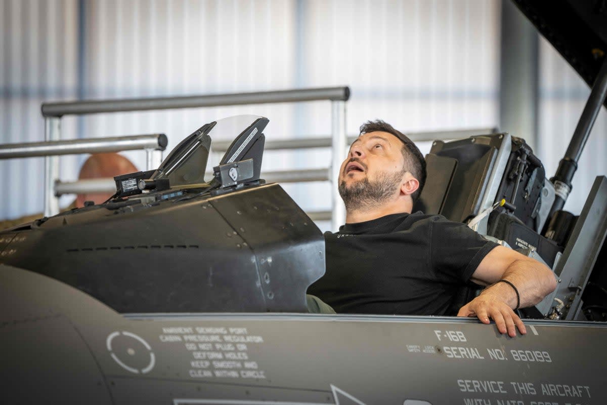 Volodymyr Zelensky sits in a F-16 fighter jet in the hangar of the Skrydstrup airbase in Vojens, northern Denmark last August (Ritzau Scanpix / AFP via Getty Images)