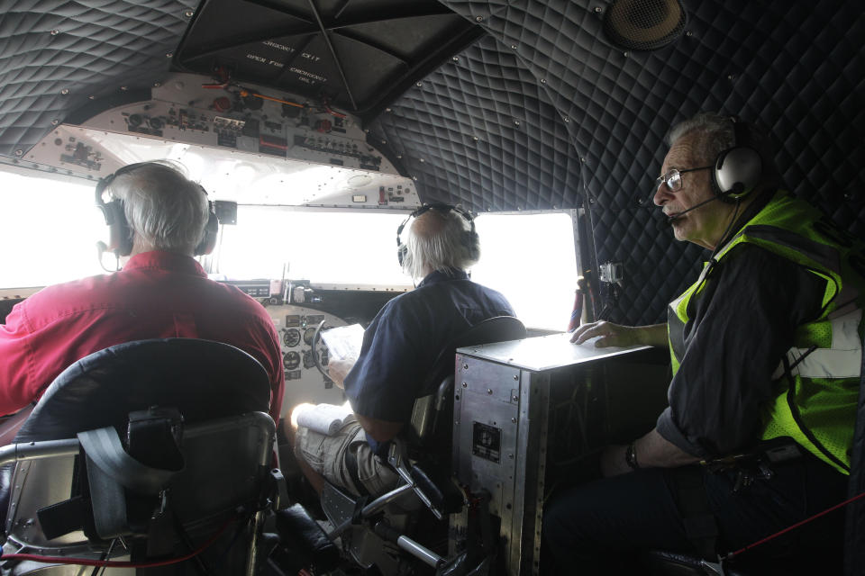 Azriel "Al" Blackman, right, flies in the cockpit of a DC-3, Wednesday, July 18, 2012 in New York. American Airlines is celebrating the 70-year service of a New York City mechanic who says he has no plans to retire. Azriel "Al" Blackman was 16 years old when he started as an apprentice mechanic in July of 1942. (AP Photo/Mary Altaffer)