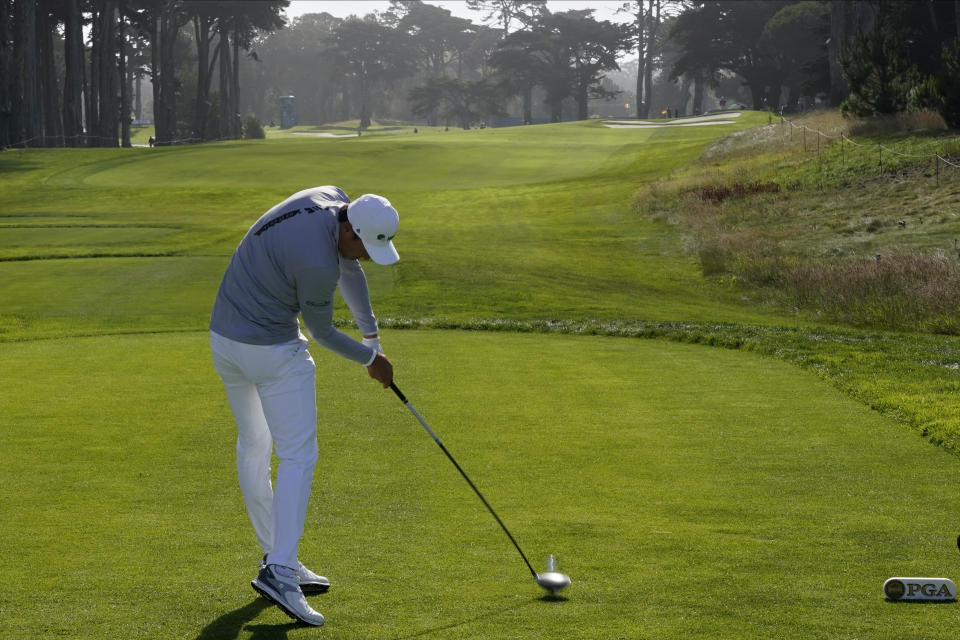 Li Haotong of China, hits his tee shot on the 10th hole during the second round of the PGA Championship golf tournament at TPC Harding Park Friday, Aug. 7, 2020, in San Francisco. (AP Photo/Charlie Riedel)