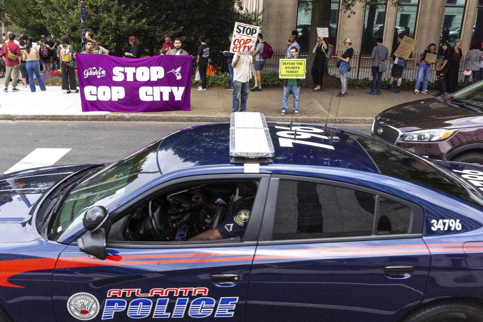 Protesters gather outside Atlanta City Hall ahead of a council vote over whether to approve public funding for the construction of a proposed police and firefighter training center, Monday, June 5, 2023. (Arvin Temkar/Atlanta Journal-Constitution via AP)