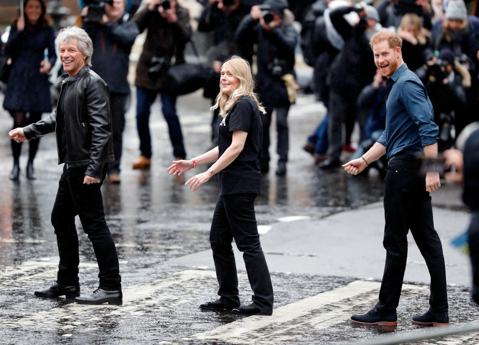 Jon Bon Jovi (L) and Prince Harry, Duke of Sussex (R) along with members of the Invictus Games Choir recreate the iconic Beatles 'Abbey Road' album cover photograph on the zebra crossing outside the Abbey Road Studios where the Invictus Games Choir are recording a special single in aid of the Invictus Games Foundation on February 28, 2020 in London, England. (Photo by Max Mumby/Indigo/Getty Images)