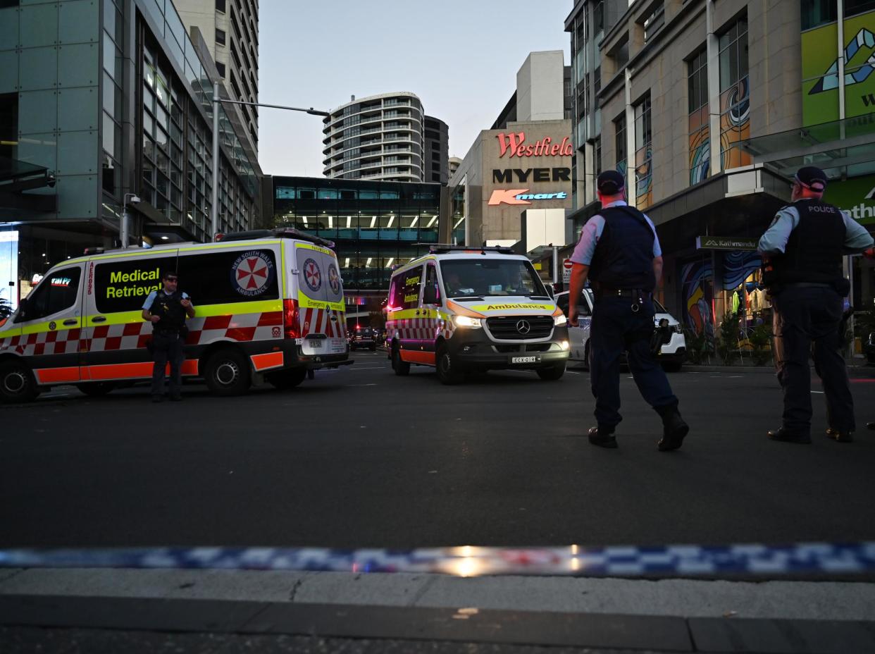 <span>Emergency services are seen at Bondi Junction after multiple people were stabbed inside the Westfield shopping centre in Sydney on Saturday.</span><span>Photograph: Steven Saphore/AAP</span>