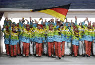 Maria Hoefl-Riesch of Germany carries the national flag as she leads the team during the opening ceremony of the 2014 Winter Olympics in Sochi, Russia, Friday, Feb. 7, 2014. (AP Photo/Mark Humphrey)