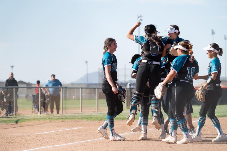Sultana's Savannah Vanderpool looks on as the rest of her teammates celebrate after defeating Apple Valley on Wednesday, April 24, 2024 in Apple Valley. Sultana defeated Apple Valley 21-2 to earn the Mojave River League title.