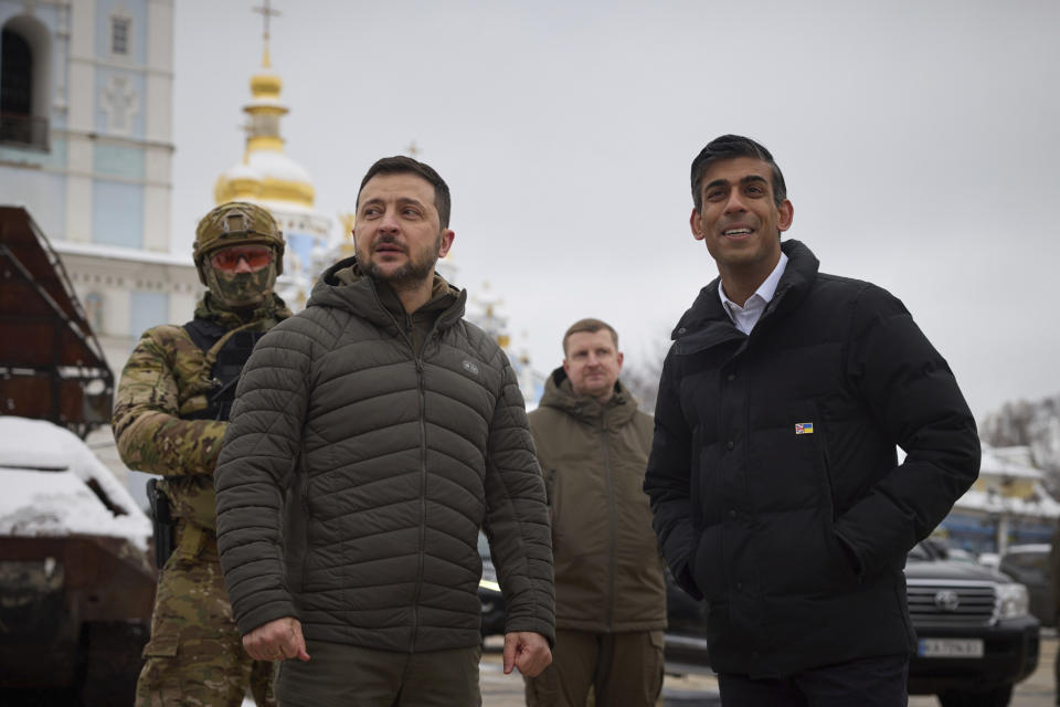 FILE - In this photo provided by the Ukrainian Presidential Press Office, Ukrainian President Volodymyr Zelenskyy, left, and British Prime Minister Rishi Sunak observe destroyed Russian military vehicles installed in downtown Kyiv, Nov. 19, 2022. British Prime Minister Rishi Sunak marks 100 days as U.K. prime minister on Thursday, Feb. 2 – more than twice the number achieved up by his ill-fated predecessor, Liz Truss. But the leader who calmed financial markets after Truss' disastrous economic plans now faces a host of challenges, from double-digit inflation and a wave of strikes to ethics scandals in the governing Conservative Party. (Ukrainian Presidential Press Office via AP, file)