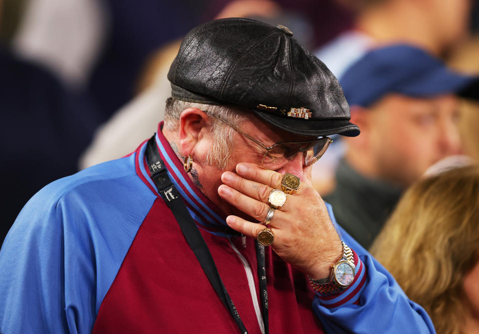 <p>LONDON, ENGLAND - SEPTEMBER 08: A West Ham United fan reacts emotionally after it was announced that Queen Elizabeth II has passed away today during the UEFA Europa Conference League group B match between West Ham United and FCSB at London Stadium on September 08, 2022 in London, England. (Photo by Marc Atkins/Getty Images)</p> 