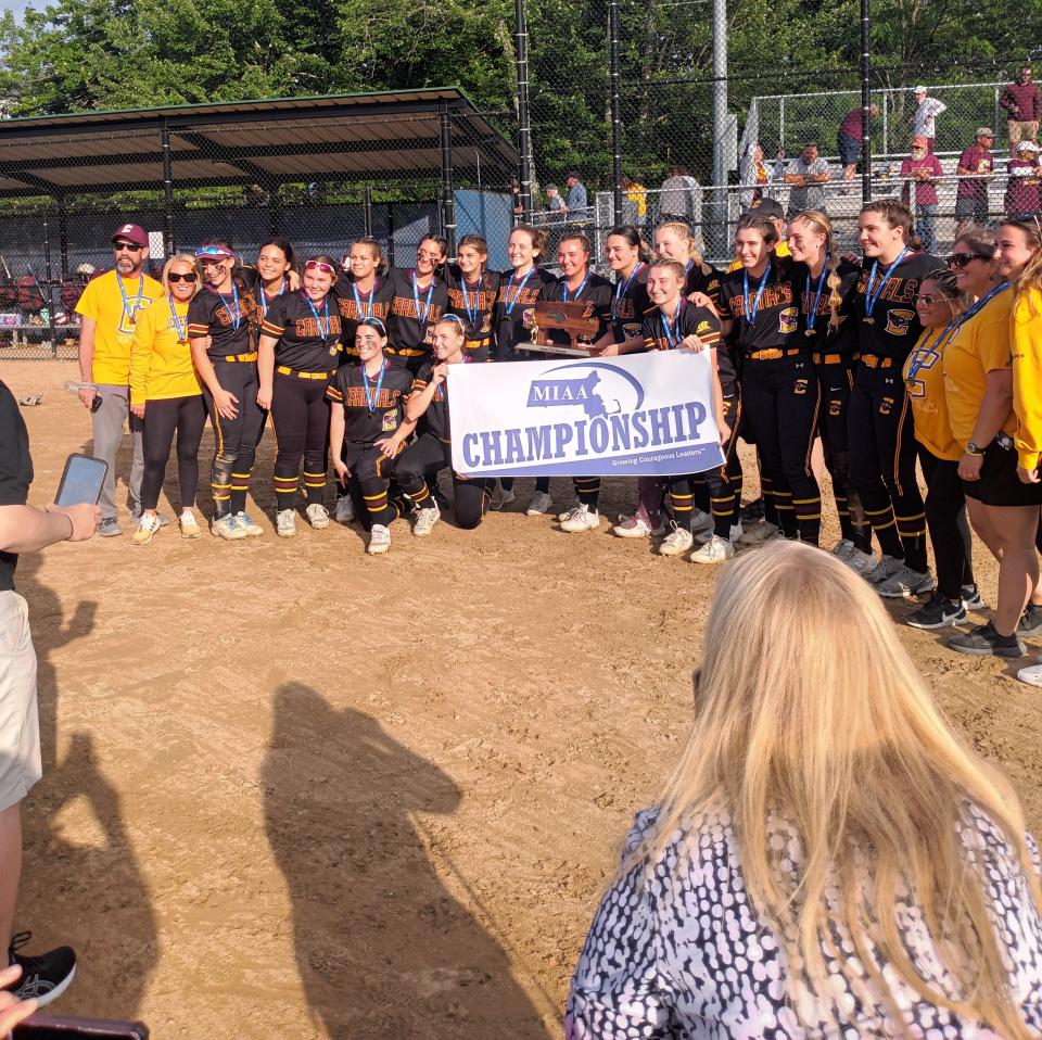 The Case softball team poses with the Division IV state trophy after beating Hampshire Regional.