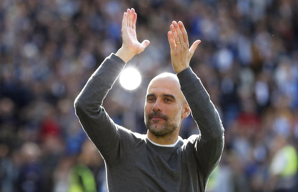 Manchester City coach Pep Guardiola celebrates after the English Premier League soccer match between Brighton and Manchester City at the AMEX Stadium in Brighton, England, Sunday, May 12, 2019. Manchester City defeated Brighton 4-1 to win the championship. (AP Photo/Frank Augstein)