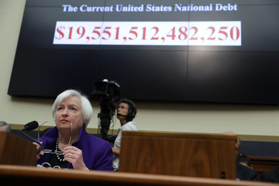 As the number of the current U.S. national debt is seen on a screen, Federal Reserve Board Chair Janet Yellen testifies during a hearing before the House Financial Services Committee on Sept. 28, 2016, on Capitol Hill.