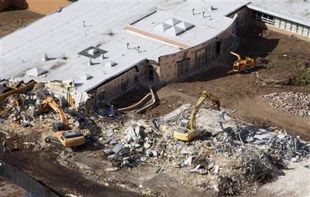 Demolition work is underway at Sandy Hook Elementary School in Newtown, Connecticut October 25, 2013. REUTERS/Michelle McLoughlin