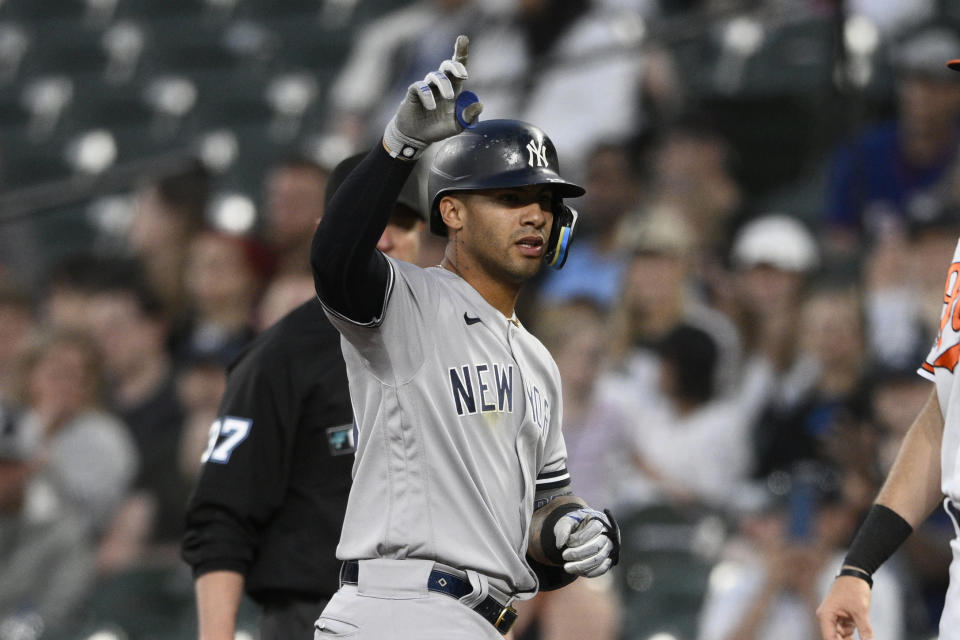 New York Yankees' Gleyber Torres gestures at first after he singled during the fourth inning of a baseball game against the Baltimore Orioles, Monday, May 16, 2022, in Baltimore. (AP Photo/Nick Wass)