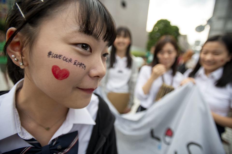 Face paint is on display at the protest in Tokyo