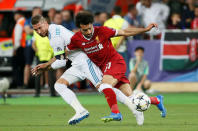 Soccer Football - Champions League Final - Real Madrid v Liverpool - NSC Olympic Stadium, Kiev, Ukraine - May 26, 2018 Liverpool's Mohamed Salah injures his shoulder in a challenge with Real Madrid's Sergio Ramos REUTERS/Gleb Garanich