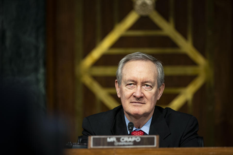 Chairman Mike Crapo, R-Idaho, listens as Federal Reserve Chair Jerome Powell and Treasury Secretary Steven Mnuchin, not pictured, testify during a Senate Banking Committee hearing on Capitol Hill, on Tuesday, Dec. 1, 2020, in Washington. (Al Drago/The New York Times via AP, Pool)
