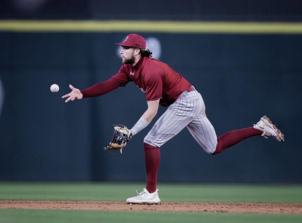 Gamecock 2nd baseman Parker Noland (11) grabs the ground ball and makes the double play. North Carolina and South Carolina would play at Truist Field on April 9, 2024.