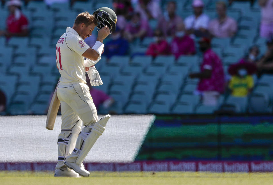 Australia's David Warner walks from the field after he was dismissed during play on day three of the third cricket test between India and Australia at the Sydney Cricket Ground, Sydney, Australia, Saturday, Jan. 9, 2021. (AP Photo/Rick Rycroft)