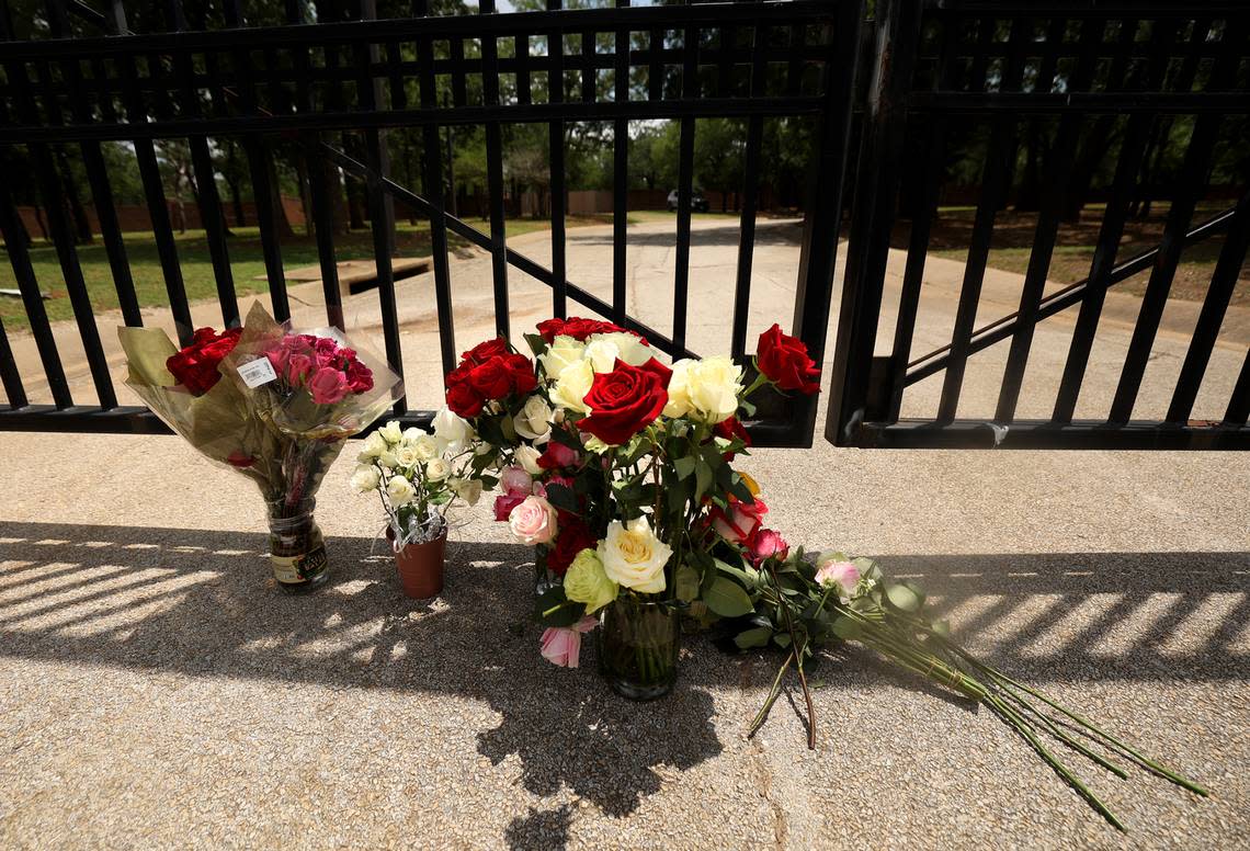 Flowers sit at the gate to the Monastery of the Most Holy Trinity, where the Discalced Carmelite Nuns of Arlington live and pray, on Wednesday, May 31, 2023. Supporters of the sisters placed the flowers outside the monastery after praying at a nearby park. Michael Olson, the Bishop of Fort Worth, has suspended daily activities, including mass and confession. Amanda McCoy/amccoy@star-telegram.com