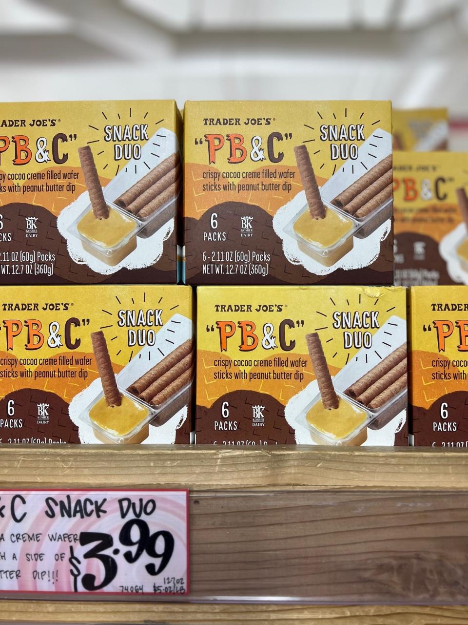 Boxes of "PB&C" Snack Duo, "crispy cocoa creme filled wafer sticks with peanut butter dip," on display