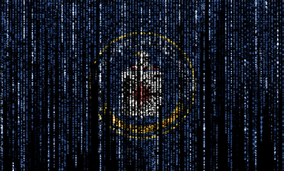 Flag of the CIA on a computer binary codes falling from the top and fading away.