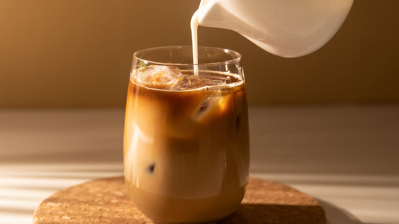 Sweet cream pouring into coffee