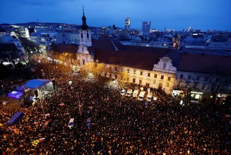 Demonstrators take part in a protest rally marking the first anniversary of the murder of the investigative reporter Jan Kuciak and his fiancee Martina Kusnirova in Bratislava, Slovakia, February 21, 2019. REUTERS/David W. Cerny