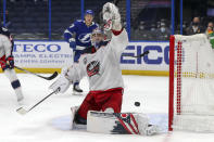 Columbus Blue Jackets goaltender Elvis Merzlikins gives up a goal to the Tampa Bay Lightning during the second period of an NHL hockey game Thursday, April 22, 2021, in Tampa, Fla. (AP Photo/Mike Carlson)