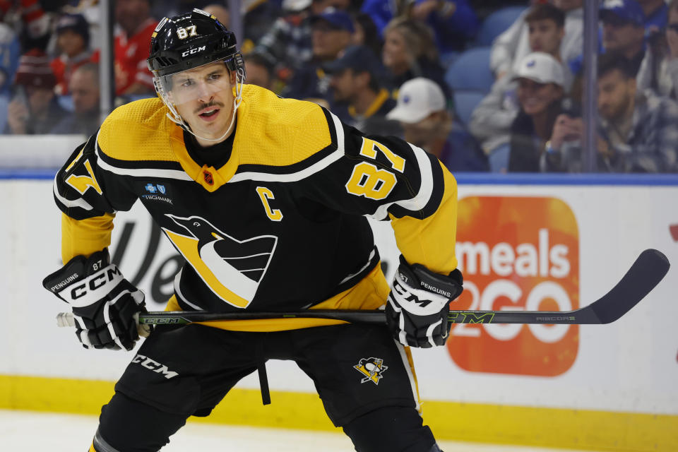 Pittsburgh Penguins center Sidney Crosby lines up for a faceoff during the first period of the team's NHL hockey game against the Buffalo Sabres, Wednesday, Nov. 2, 2022, in Buffalo, N.Y. (AP Photo/Jeffrey T. Barnes)