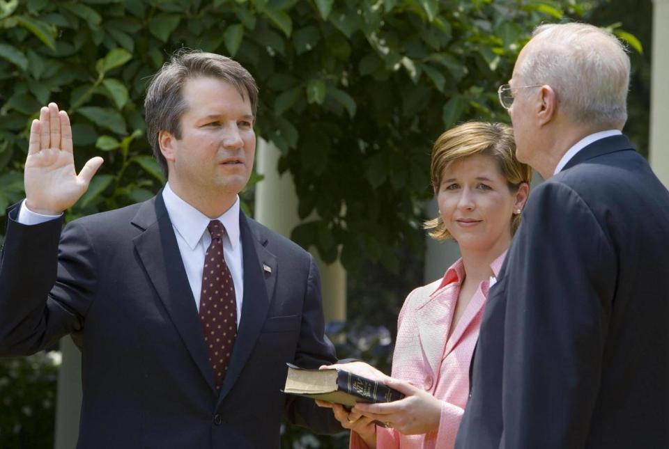 Brett Kavanaugh is sworn in as a US Court of Appeals Judge for the District of Columbia by US Supreme Court Justice Anthony Kennedy (PAUL J. RICHARDS/AFP/Getty Images)