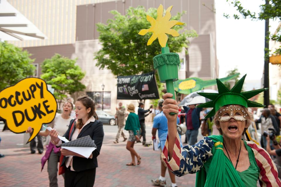 Protesters demonstrate during Duke Energy's annual shareholder meeting on May 1, 2014 in Charlotte, North Carolina, after a massive coal ash spill at Duke Energy's Dan River Steam Station.