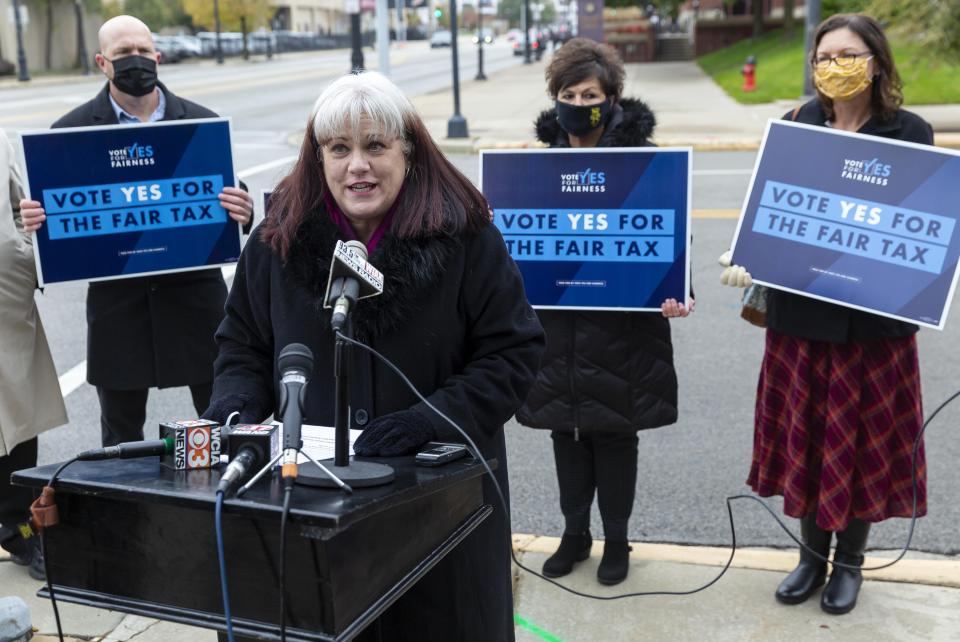 Brigid Leahy, director of government relations for Planned Parenthood of Illinois, delivers her remarks as she is joined by then-state Sen. Andy Manar, D-Bunker Hill, and leaders representing education, social services and labor urging everyone to vote early and to vote for the graduated income tax during a press conference outside the Sangamon County Complex on Oct. 27, 2020, in Springfield.