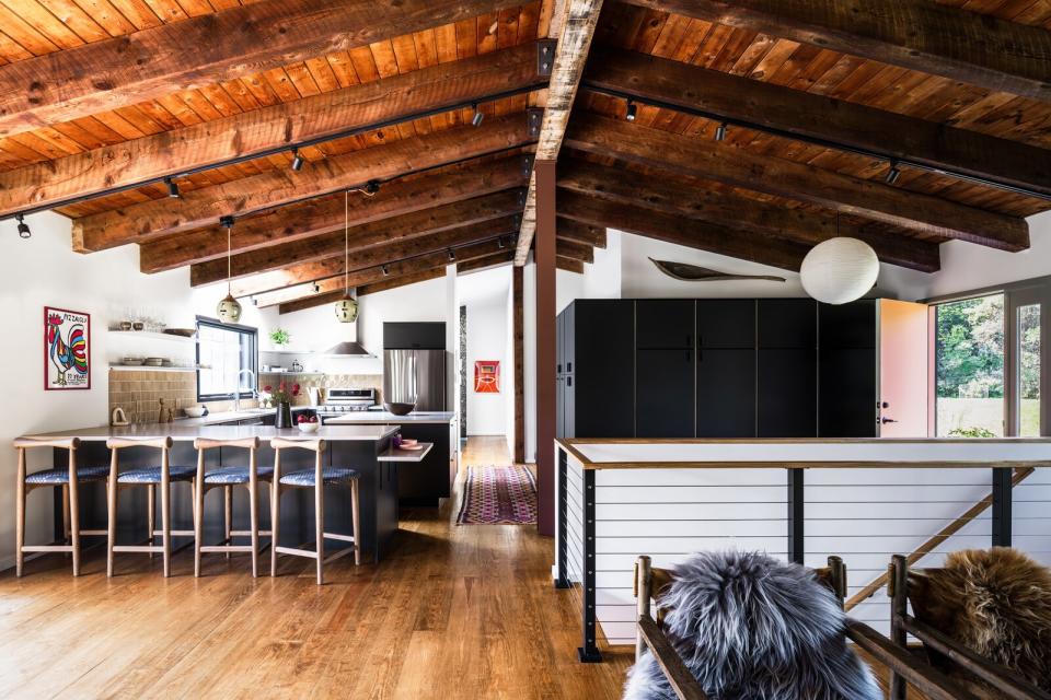 The renovation reconfigured the kitchen to include a peninsula, which has a secondary level for the owners' wheelchair-using daughter.