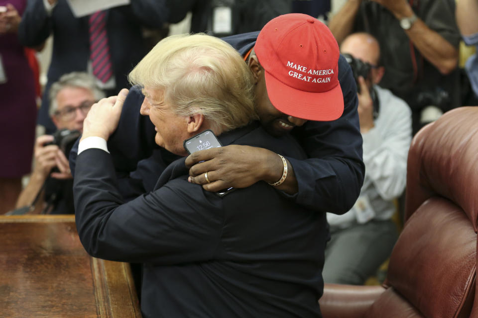 Trump hugs West during their meeting in the Oval Office. (Photo: Oliver Contreras/Pool/Getty Images)