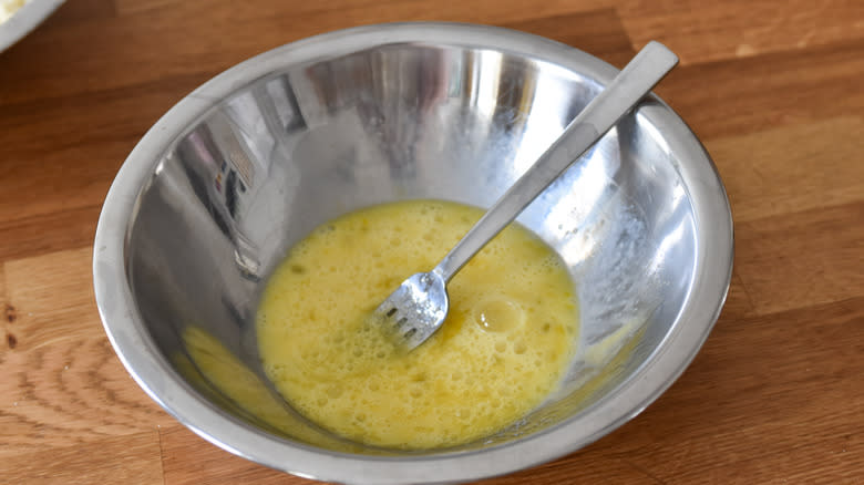 mixing eggs in bowl