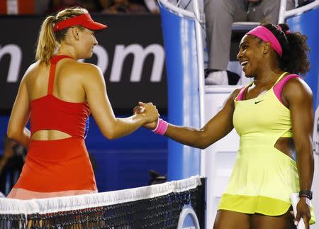 Serena Williams (R) of the U.S. shakes hands with Maria Sharapova of Russia after defeating her in their women's singles final match at the Australian Open 2015 tennis tournament in Melbourne January 31, 2015. REUTERS/David Gray