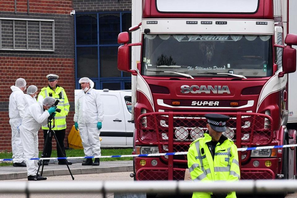 Police and forensic officers investigating the lorry (Getty Images)