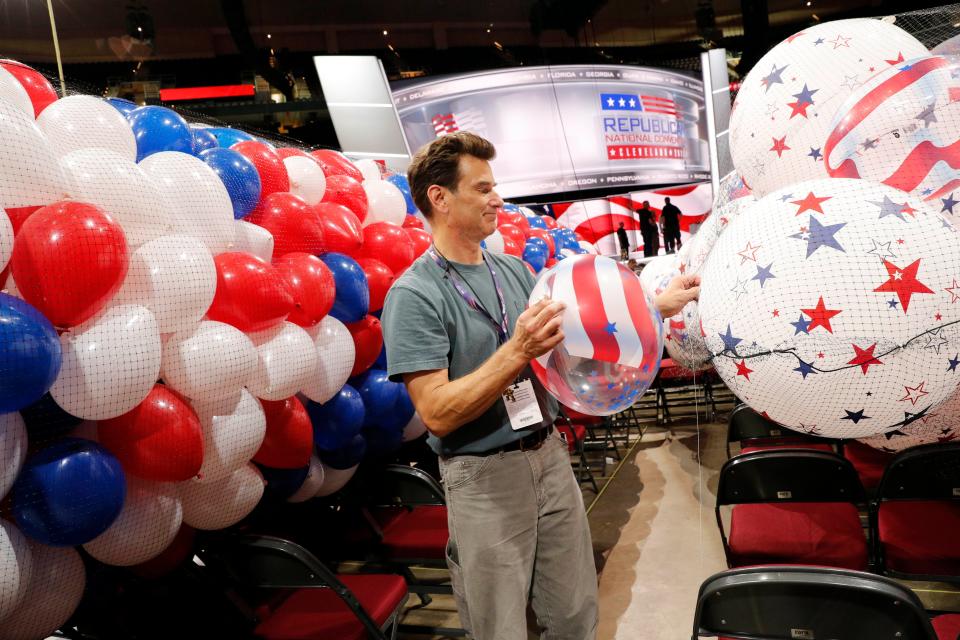 Whitman Heining of Glasshouse Balloons prepares balloons for the 2016 Republican National Convention held at the Quicken Loans Arena.