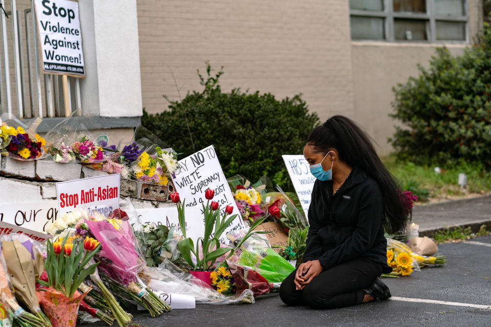 A mourner at a makeshift memorial for the victims of a shooting at Gold Spa in Acworth, Ga., March 19<span class="copyright">Jeenah Moon—The New York Times/Redux</span>